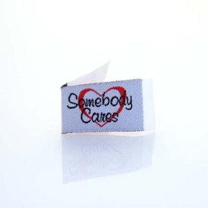 Tag-It-Ons TI006, Embroidered Sew In Labels, Bag of 12 Tag It's: Somebody Cares